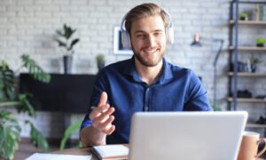 Confident man wearing headset speaking and