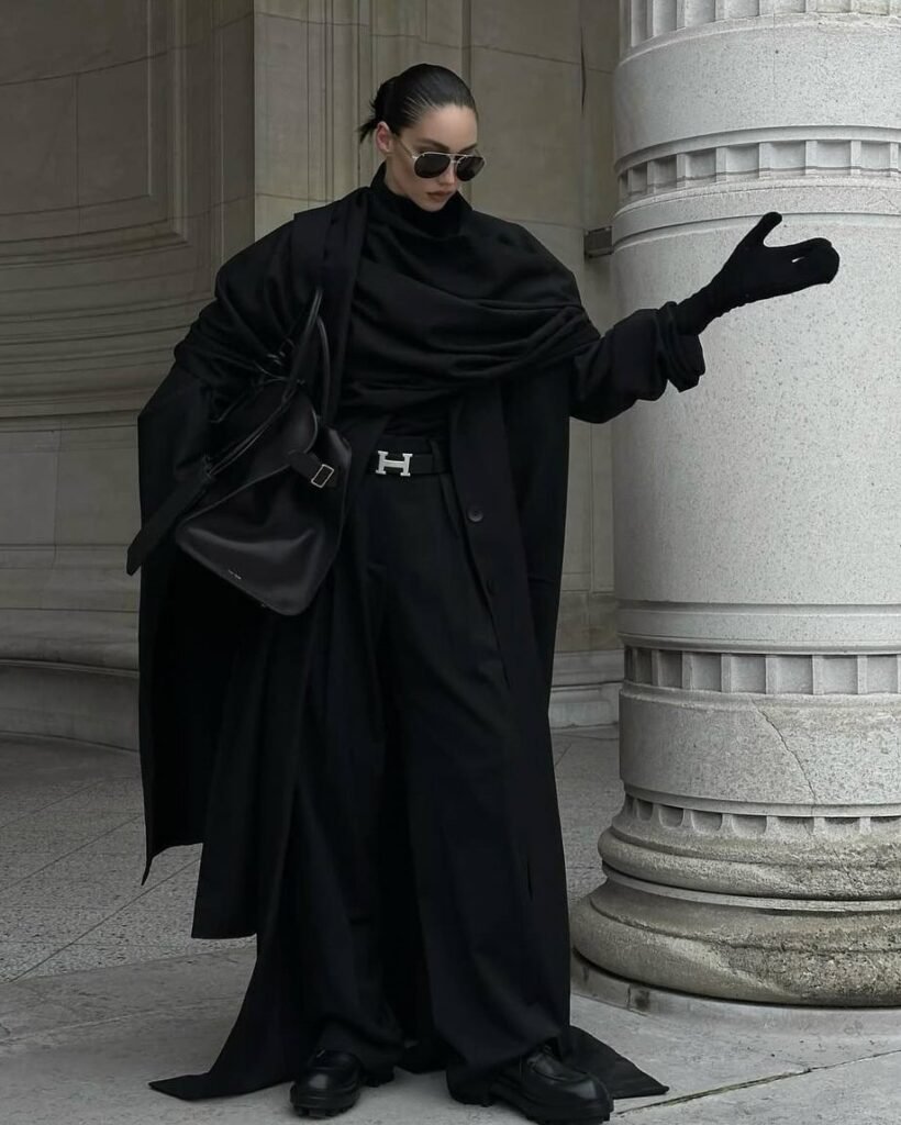 Black outfit is about control and power