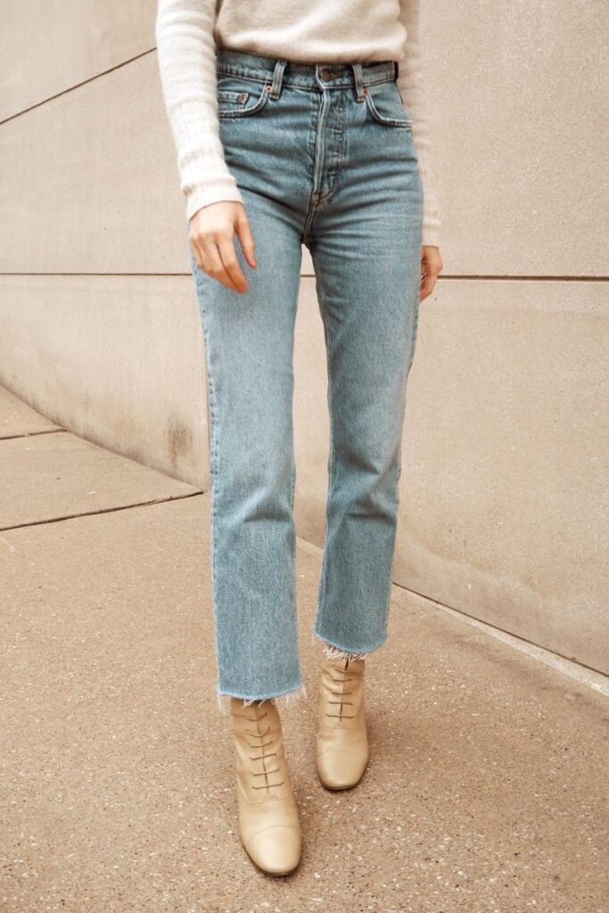 woman in straight-cut blue jeans