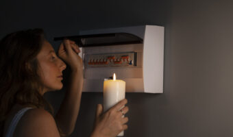 side-view-woman-checking-electrical-panel